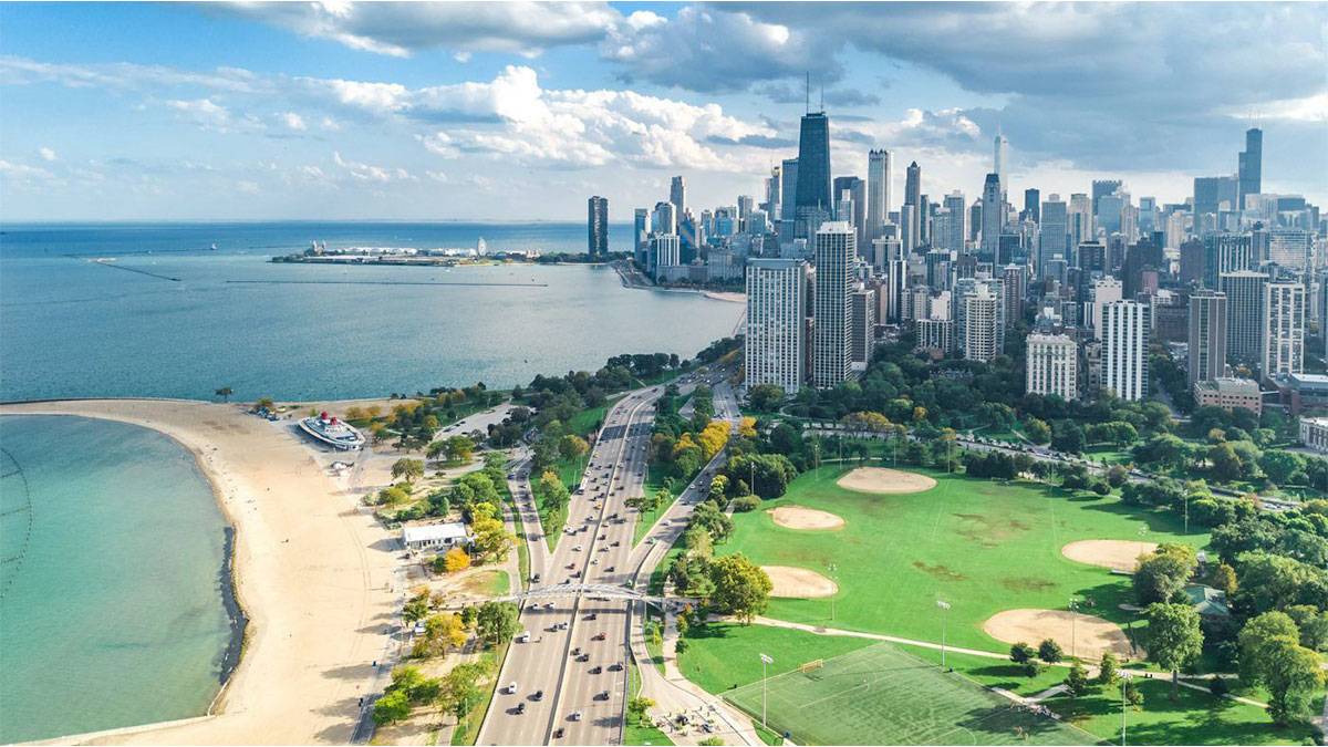 Chicago skyline aerial drone view from above, lake Michigan and city of Chicago downtown skyscrapers cityscape from Lincoln park, Illinois, USA